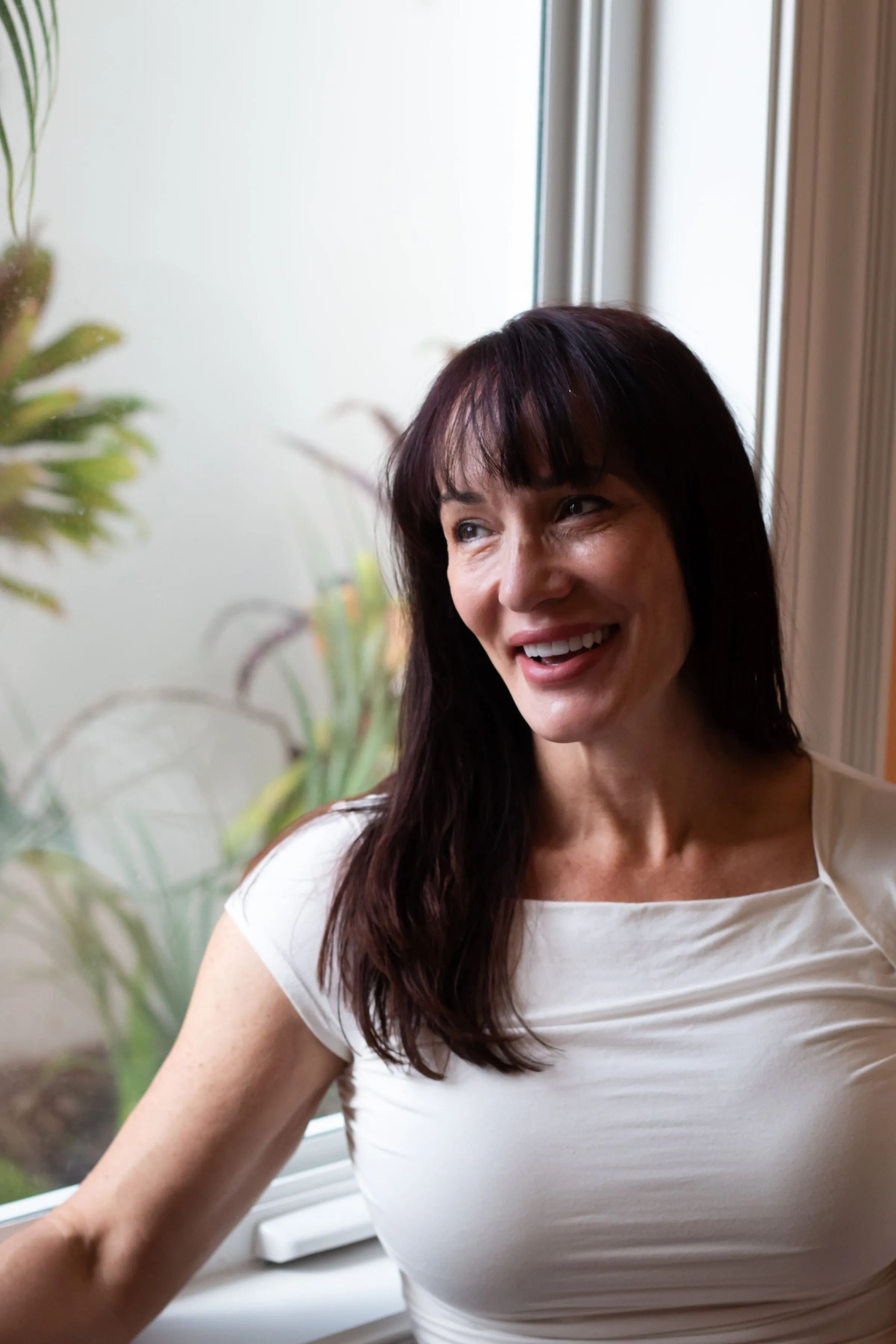 Dr. Jenifer Back laughing, photographed at Sarasota Smile Design in Sarasota, Florida