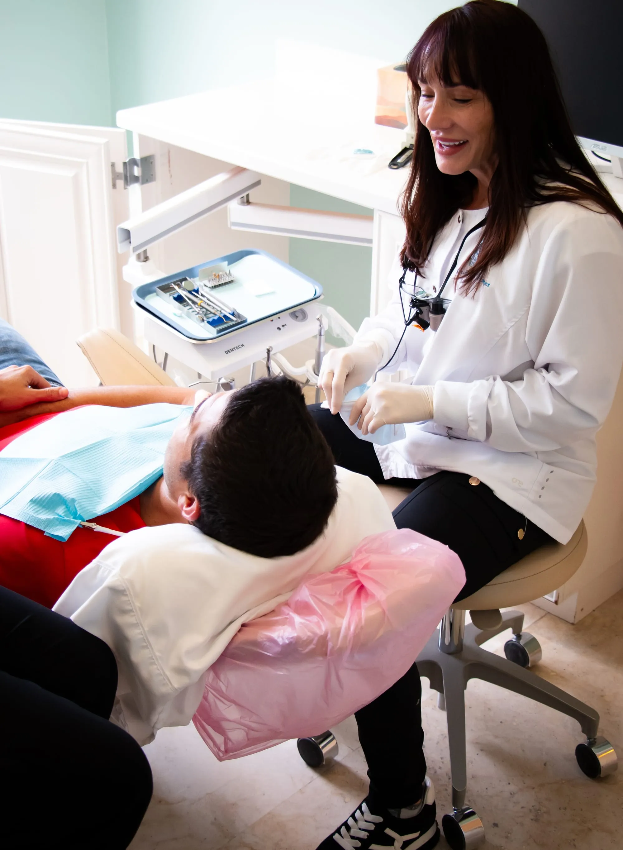 Dr. Jenifer Back treating a patient at Sarasota Smile Design in Sarasota, Florida
