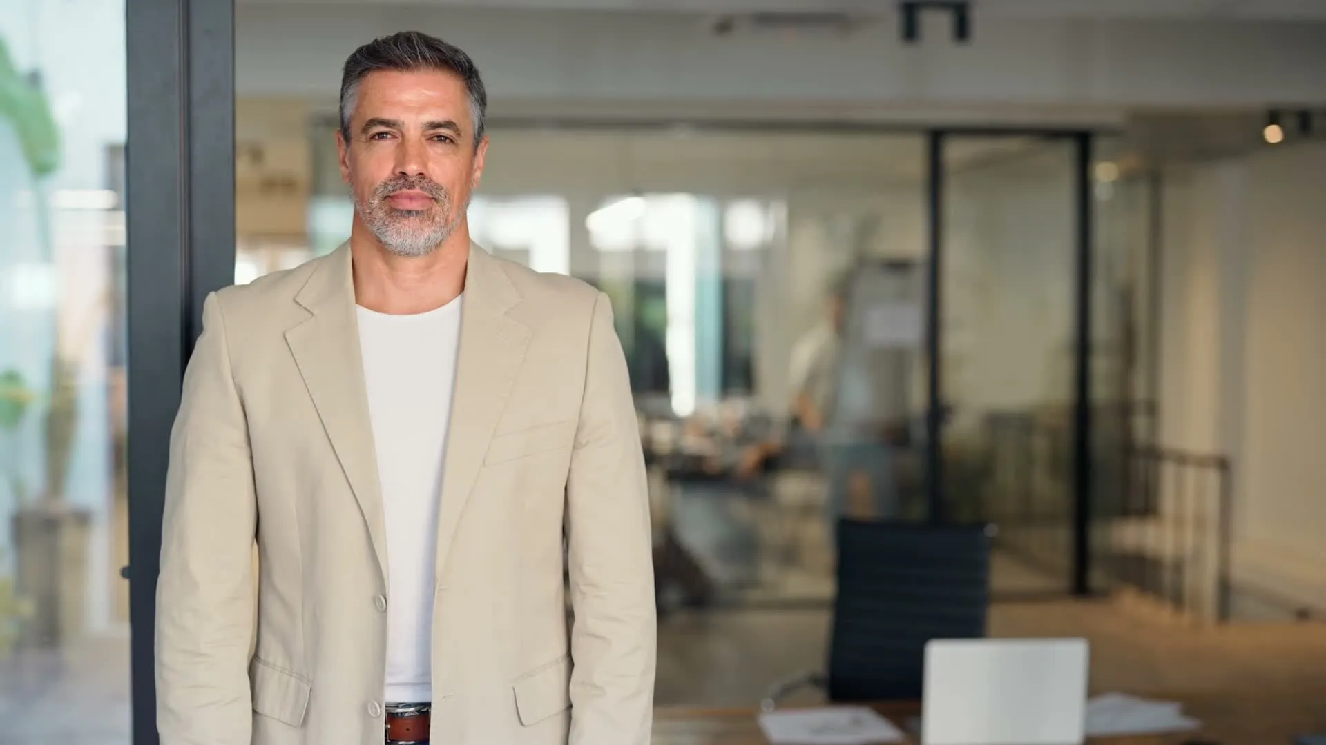 A man smiling in an office
