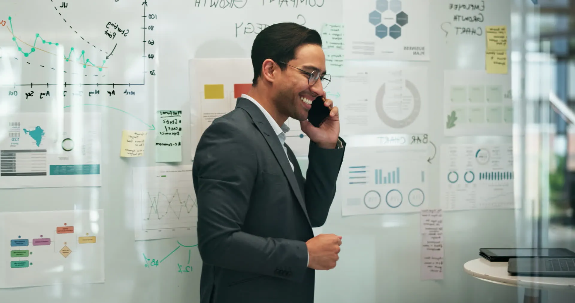 A man smiling at work in a bright office