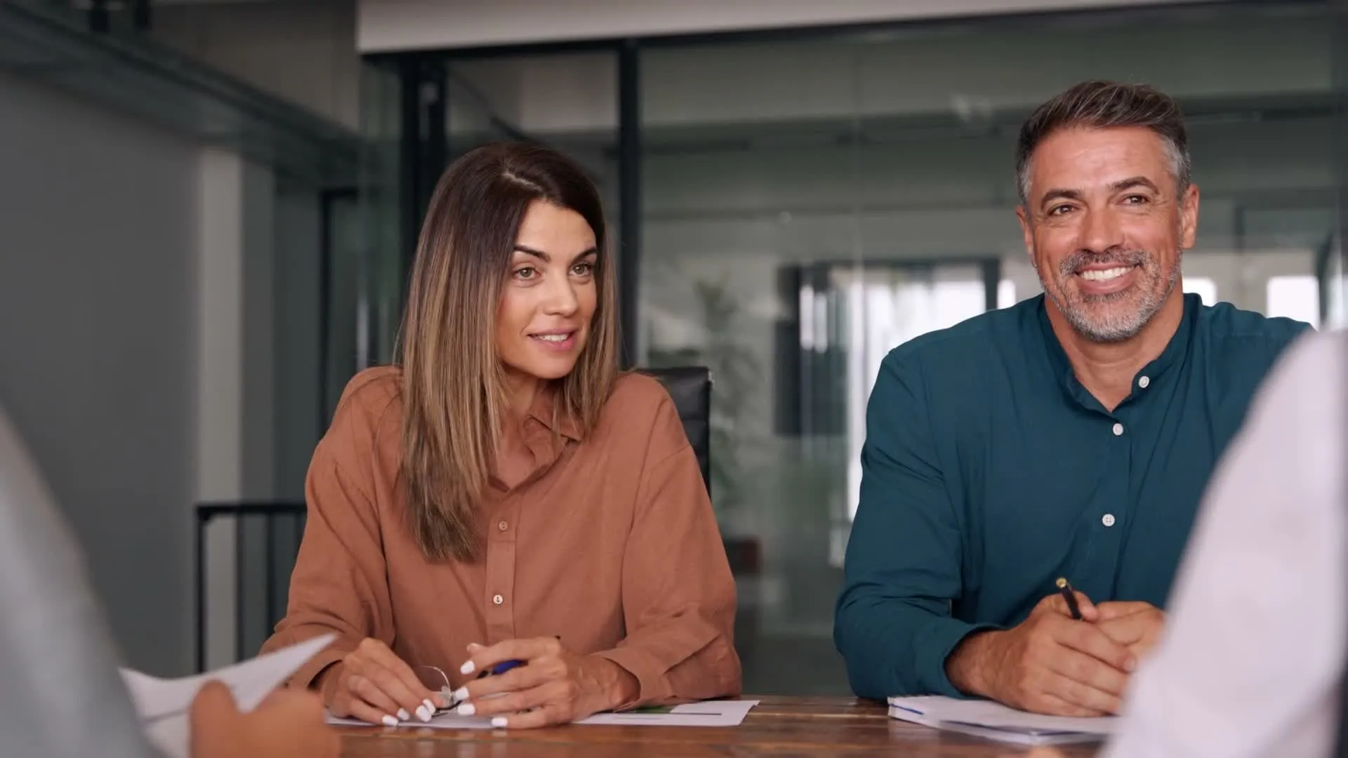 Two people talking and smiling