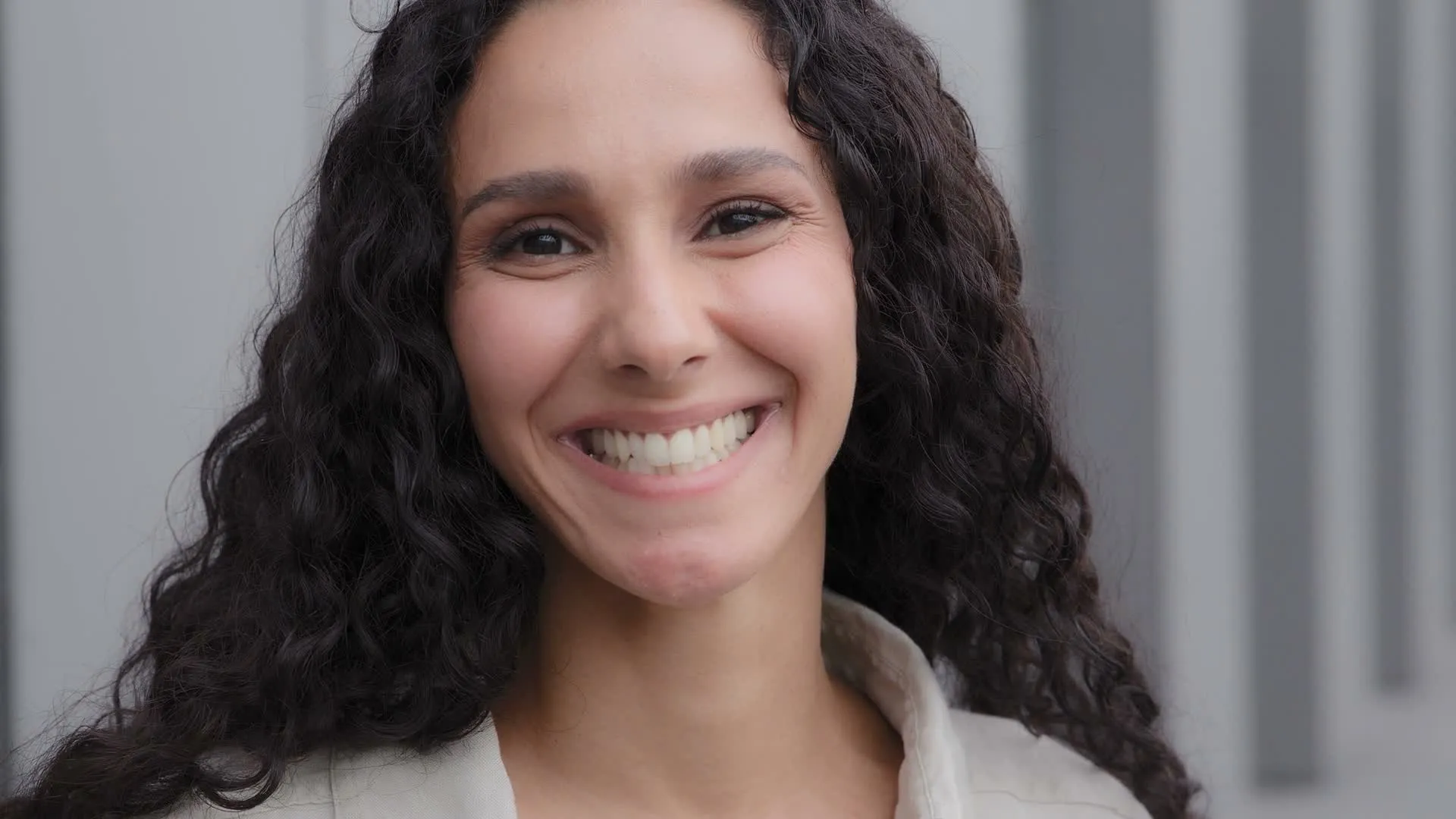 A woman smiling in bright natural light in Sarasota, Florida