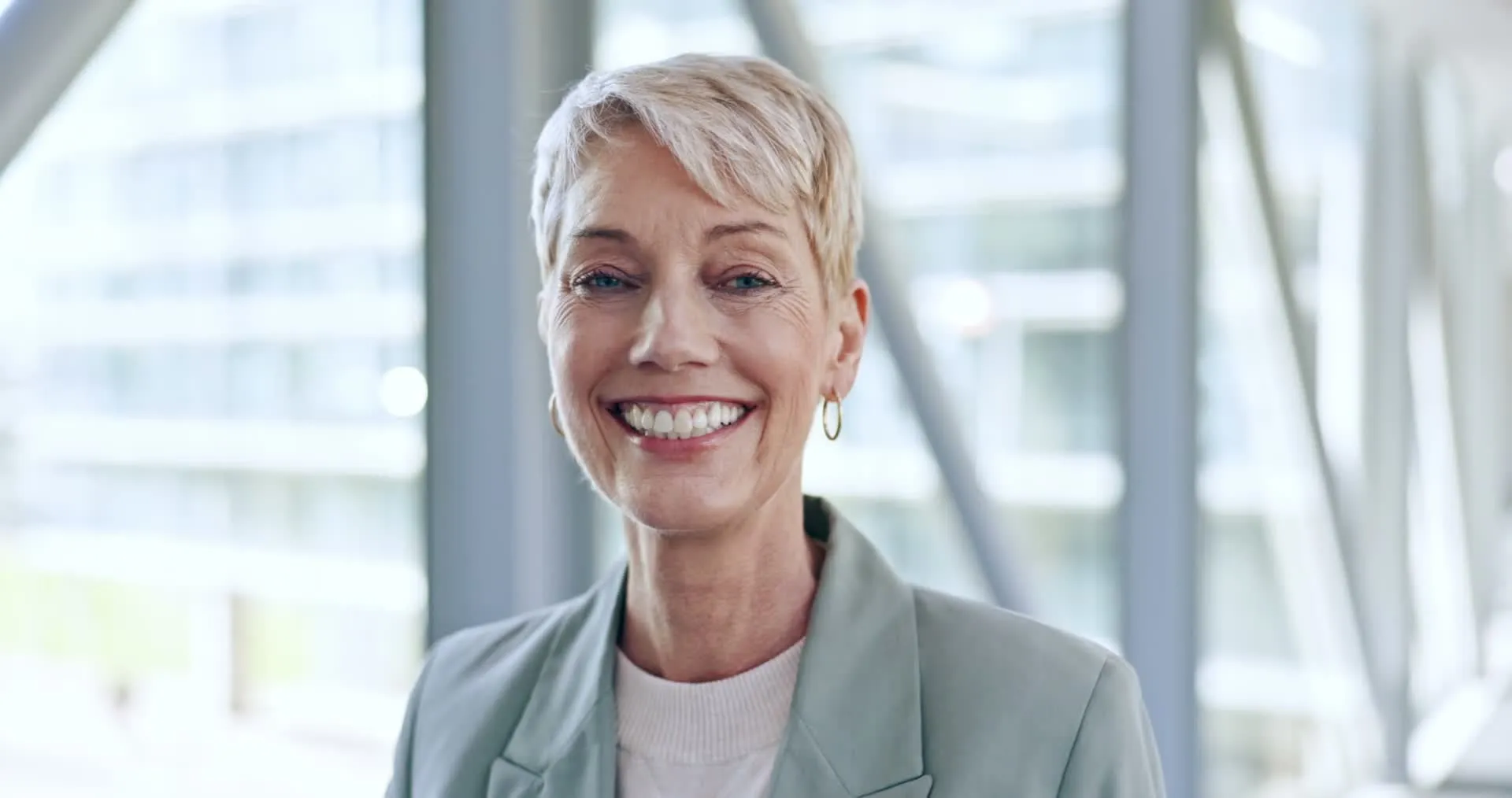 A woman smiling in a business setting