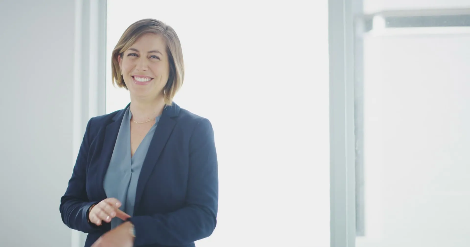 A woman working at a bright office desk