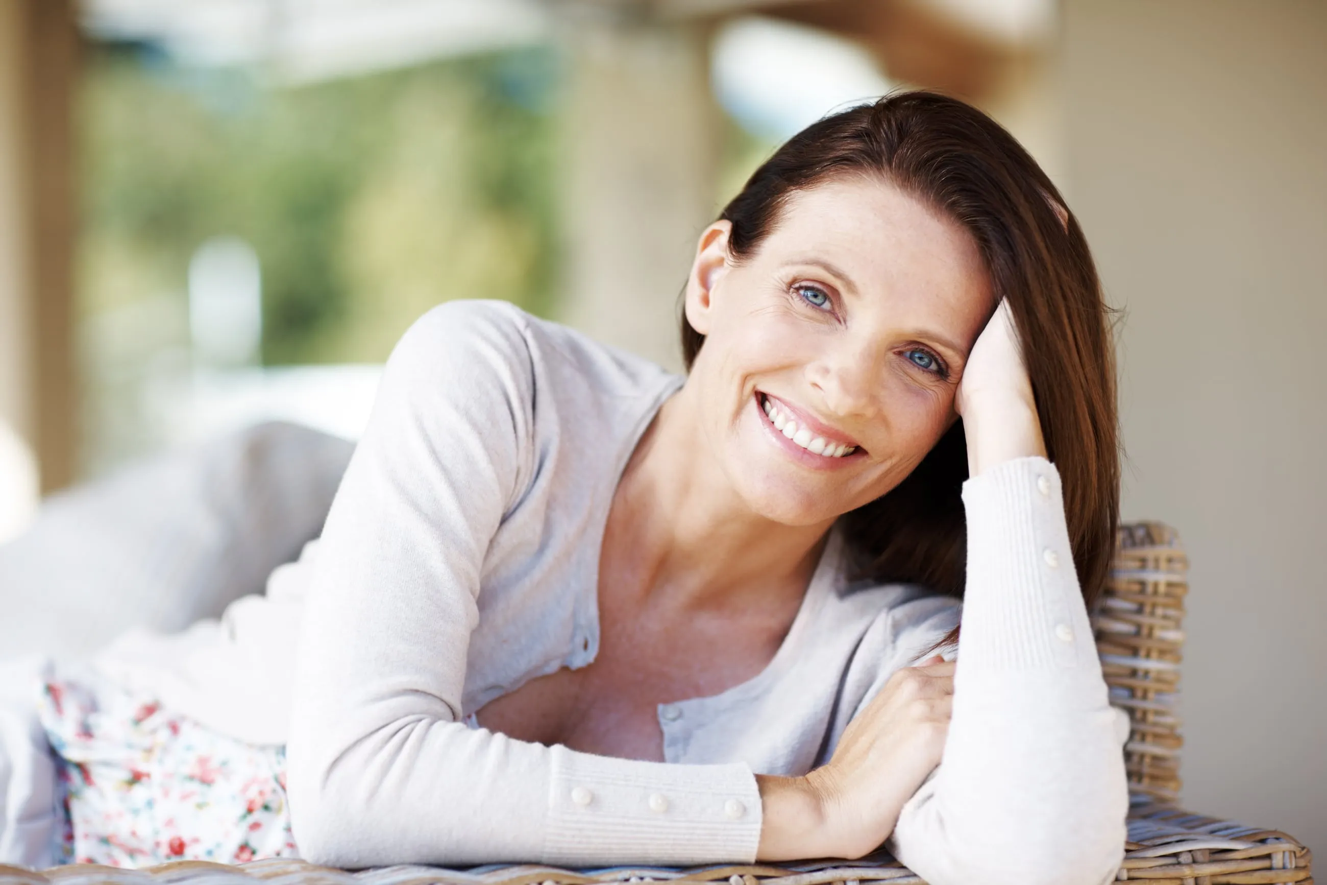 A woman smiling at home in natural light in Sarasota, Florida