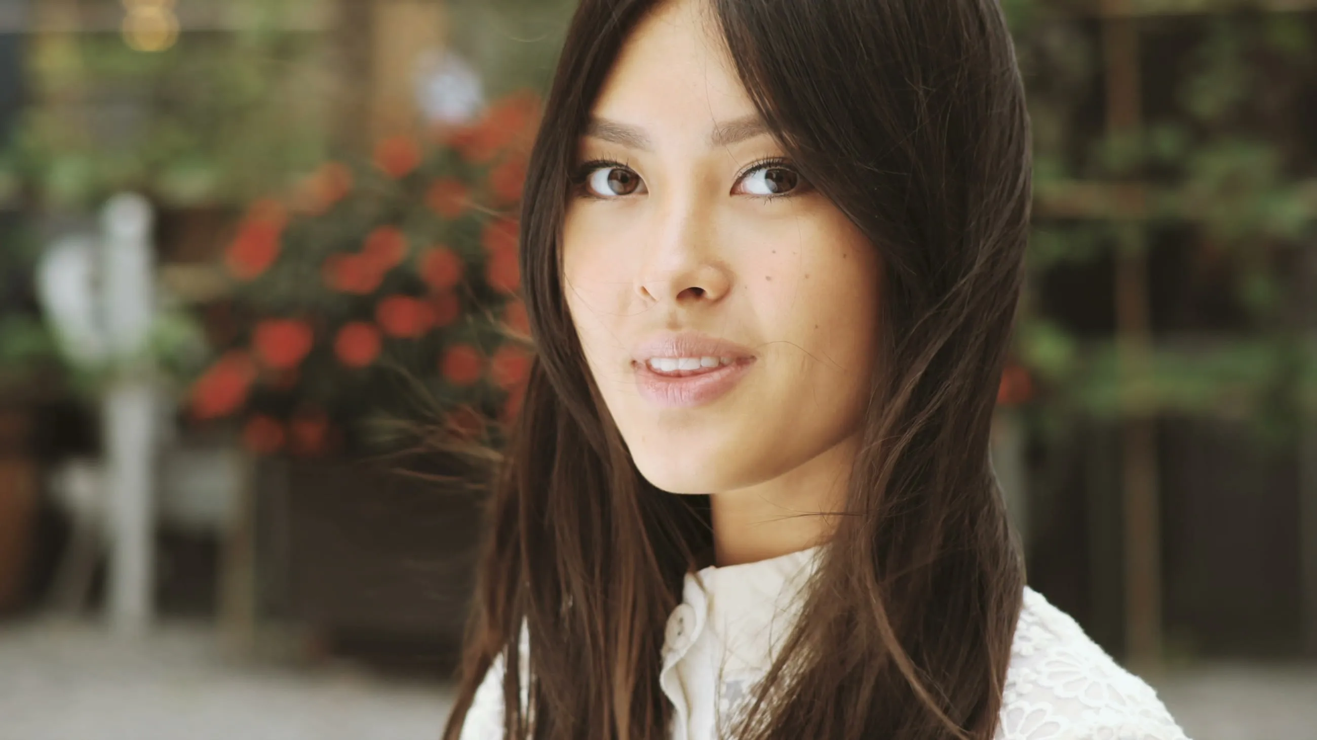 A young woman smiling to camera
